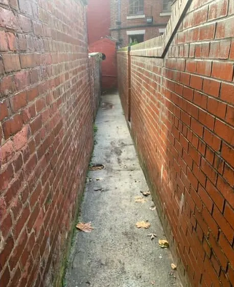 After: a clear narrow alley between brick walls