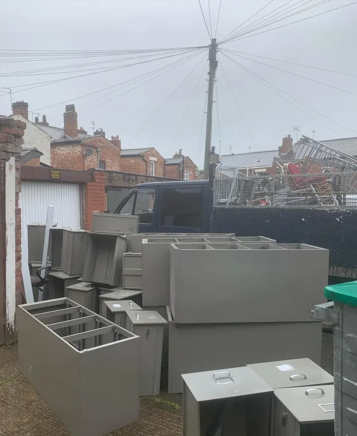 Before: a yard full of grey metal storage cabinets and units