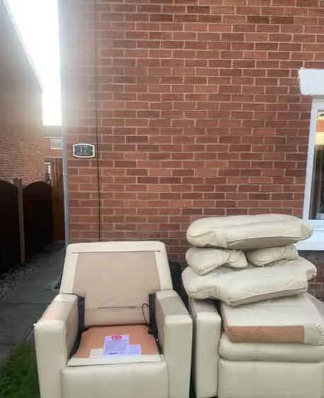 Before: a cream leather recliner suite stacked on a lawn